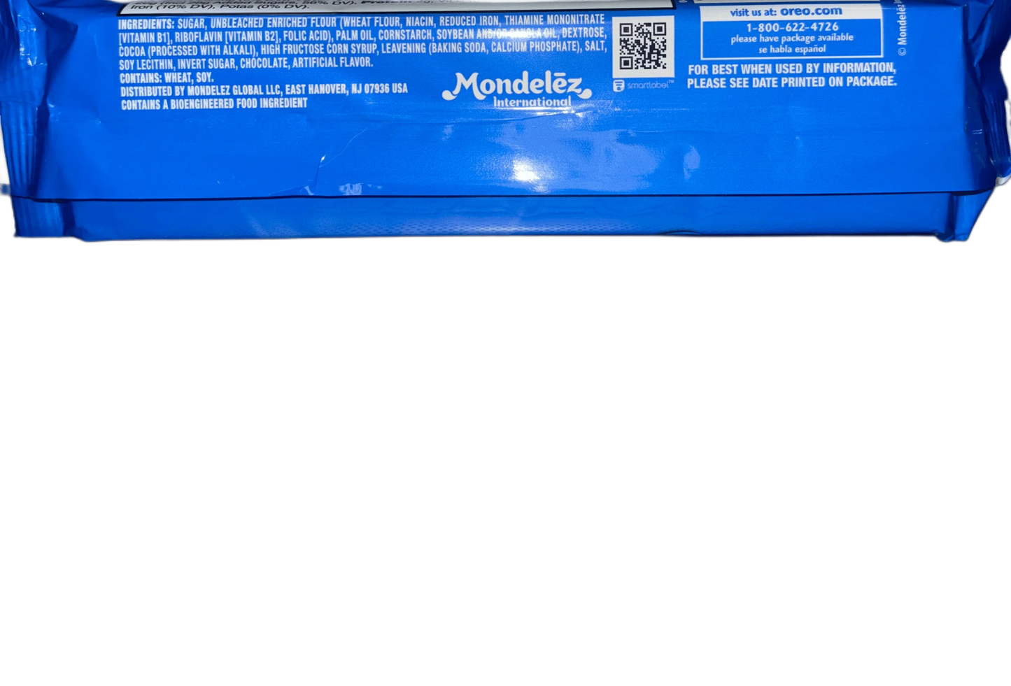 Close-up of blue snack packaging showing ingredients, nutrition details, and Mondelez International logo.
