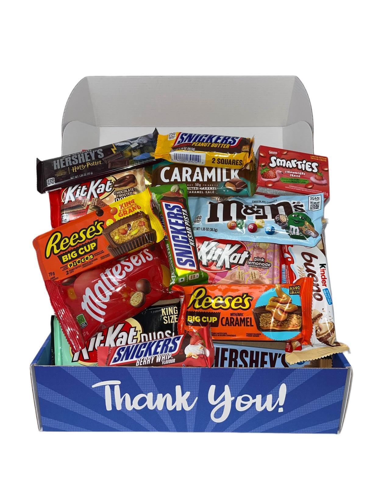 Assorted international candy bars and snacks in a blue thank you gift box