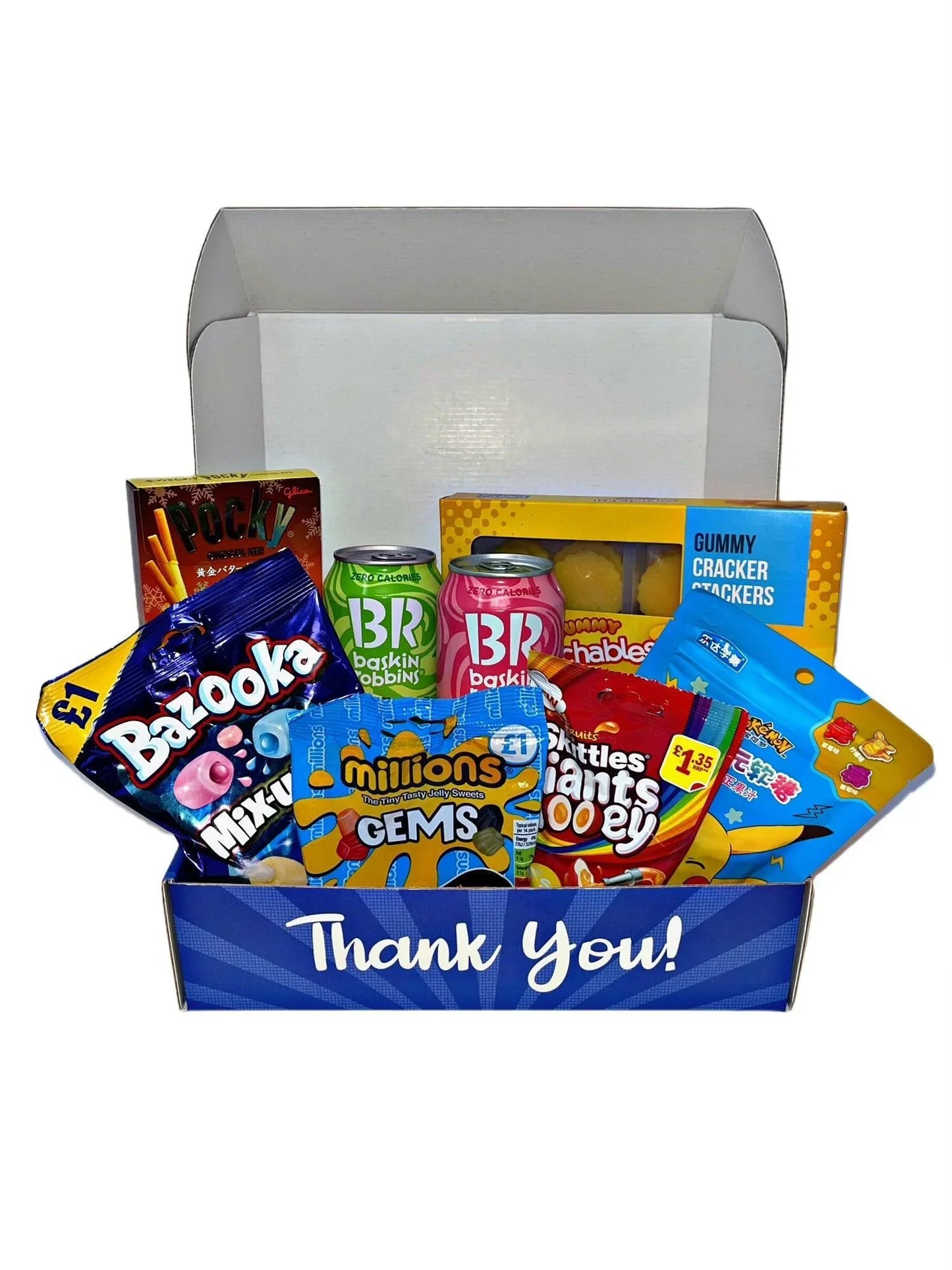 Gift box with international snacks, candy, drinks, and cereal, labeled 'Thank You'.