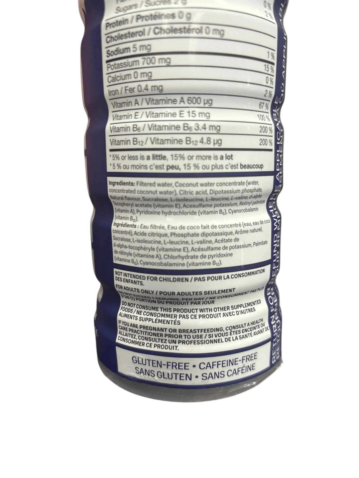 Close-up of nutrition facts and ingredients on exotic gluten-free, caffeine-free drink bottle