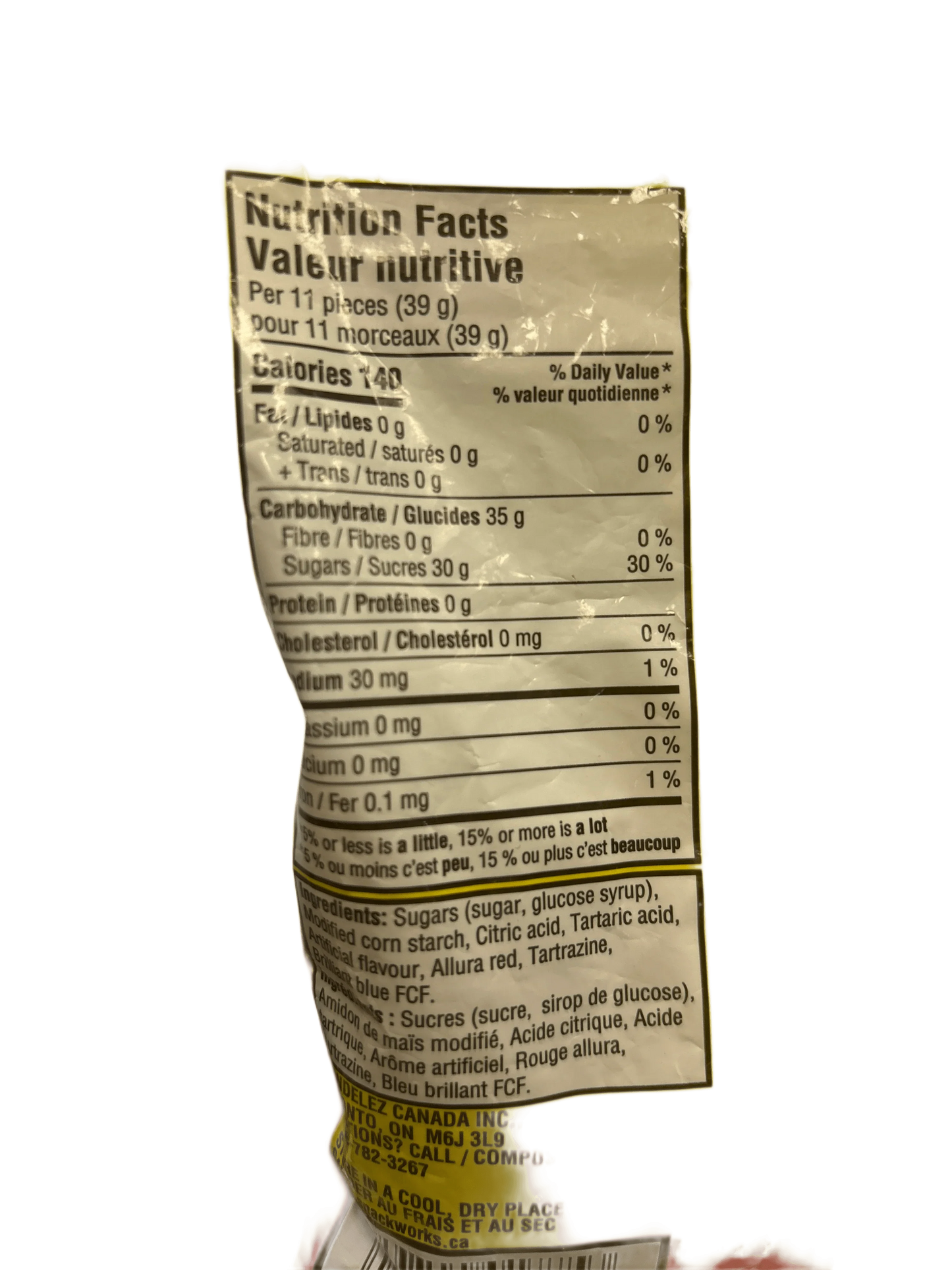 Back of exotic snack package showing nutrition facts and ingredients label in English and French.