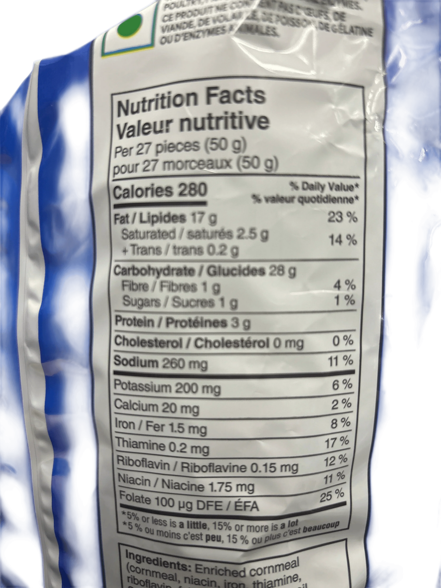 Close-up of snack nutrition facts label in English and French on a blue package