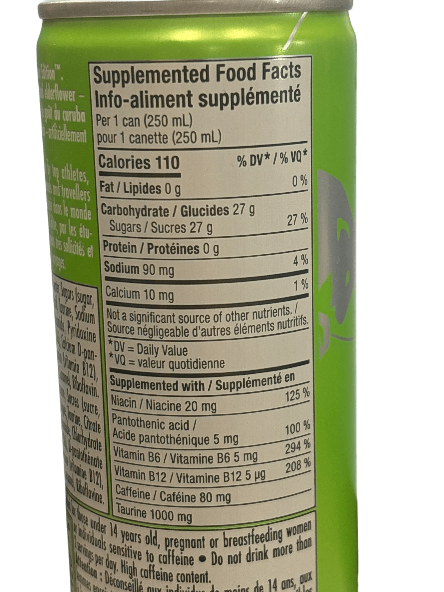 Green imported drink can with nutritional facts label, including vitamins, caffeine, and taurine details