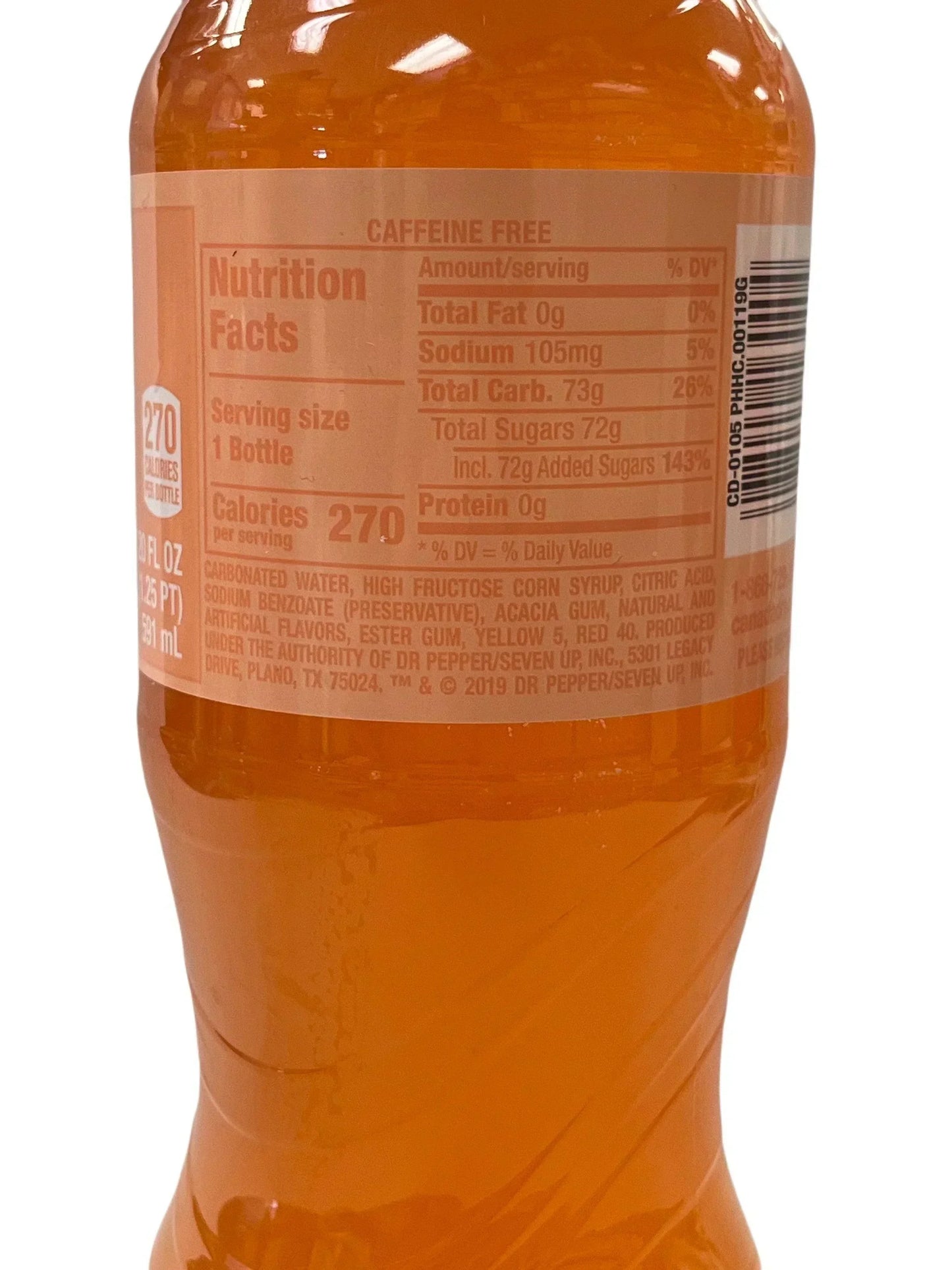 Close-up of an orange exotic soda bottle nutrition label showing ingredients and calories