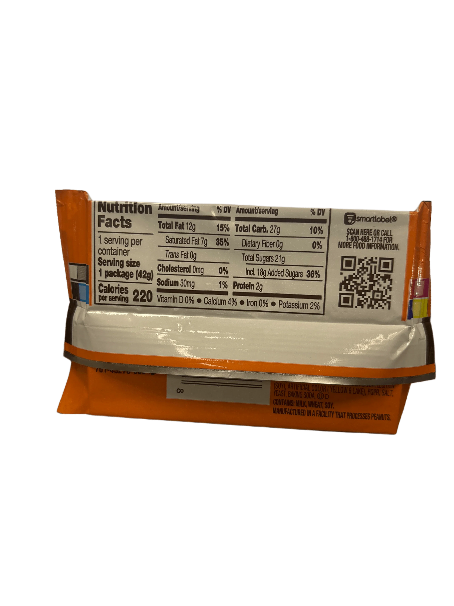 Back of candy bar wrapper showing nutrition facts, ingredients, and QR code