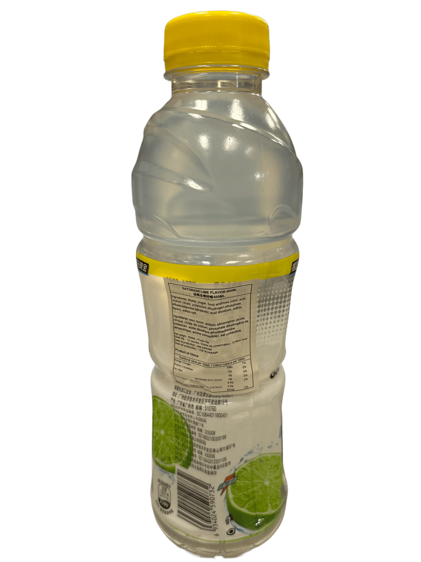Clear lime-flavored drink bottle with yellow cap, nutrition label, and lime images