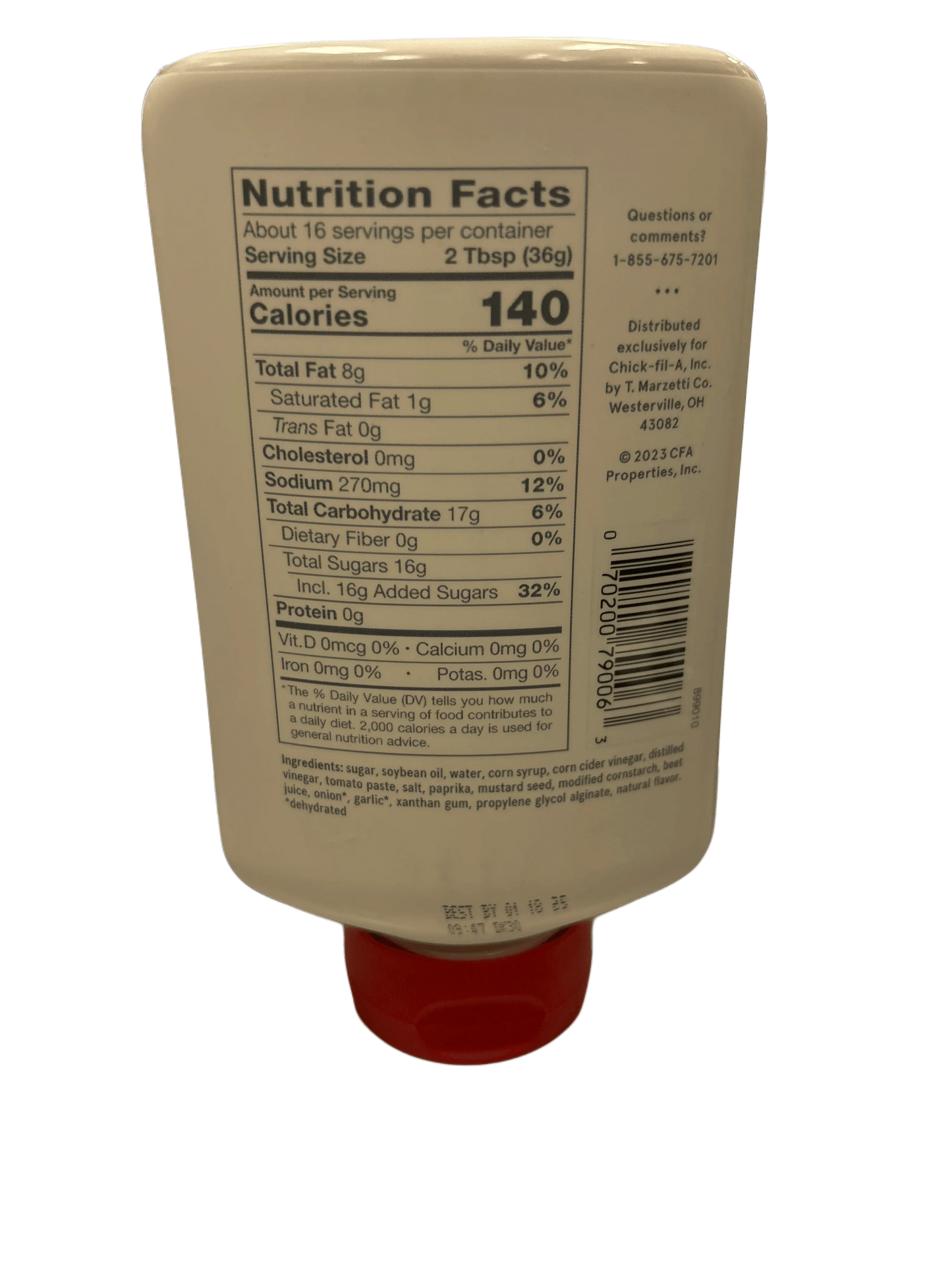 Squeeze bottle of sauce showing nutrition facts label with ingredient list and serving details