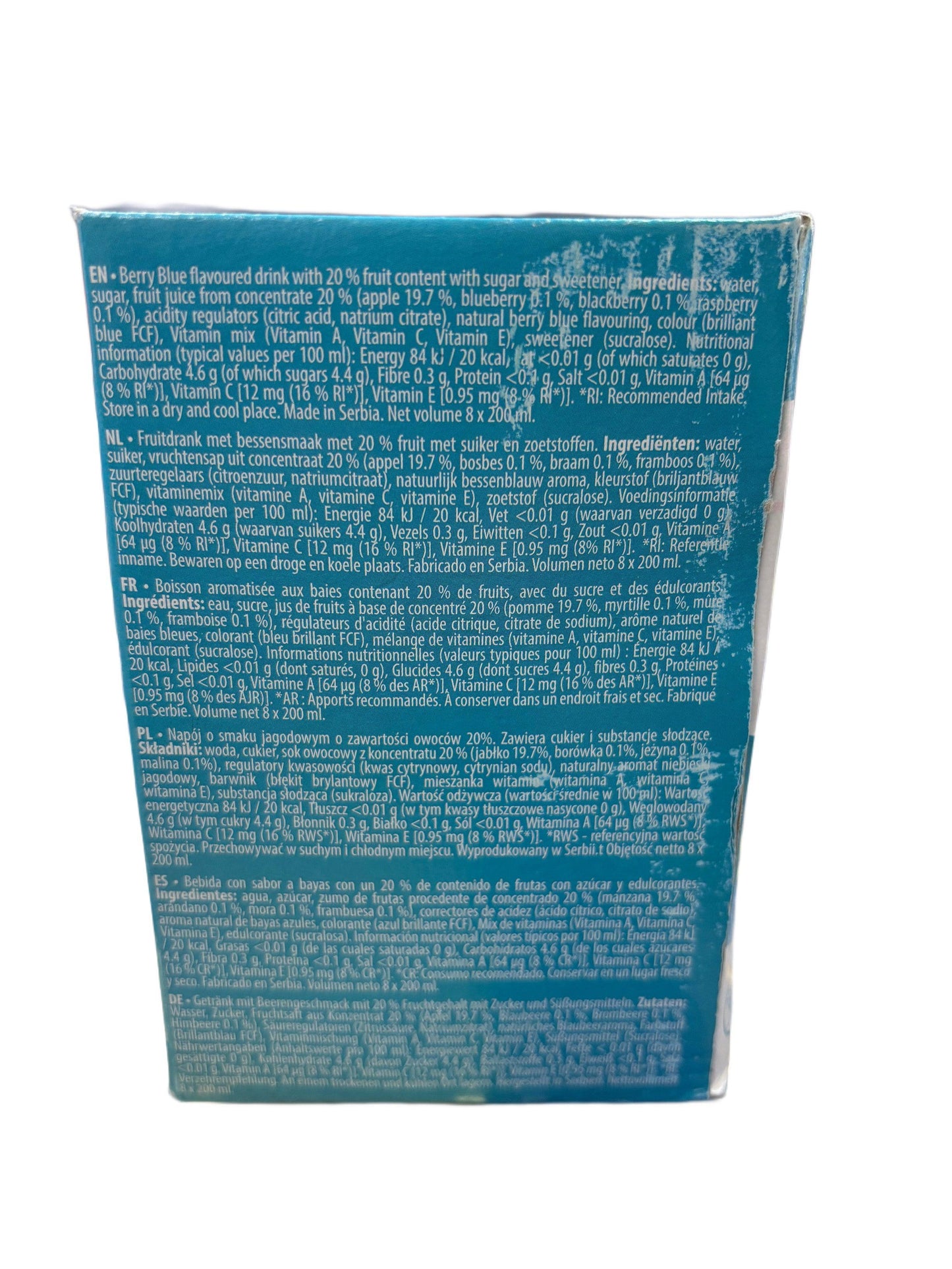 Berry Blue flavoured drink ingredients and nutrition label on blue packaging, multiple languages