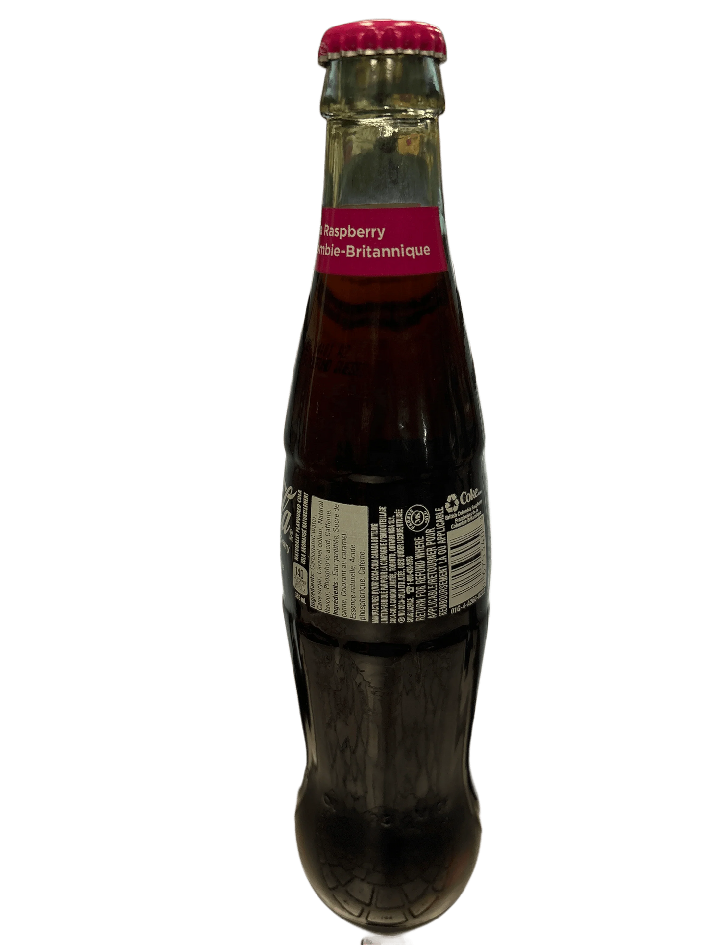 Imported raspberry soda in glass bottle with pink label and cap, exotic drink snack