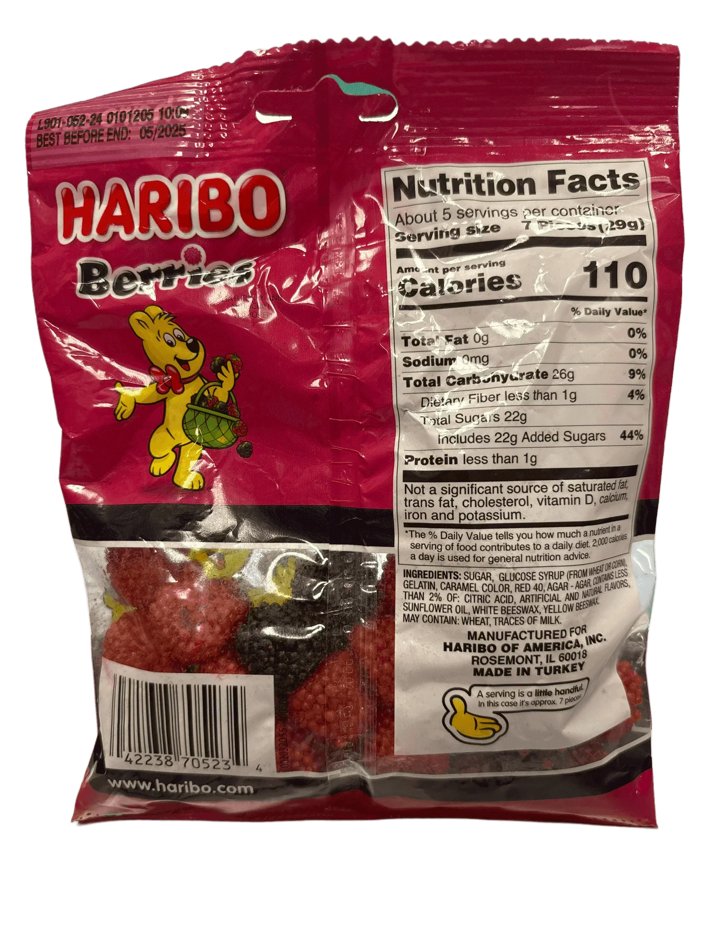 Back of Haribo Berries candy bag with nutrition facts and gummy candy visible inside