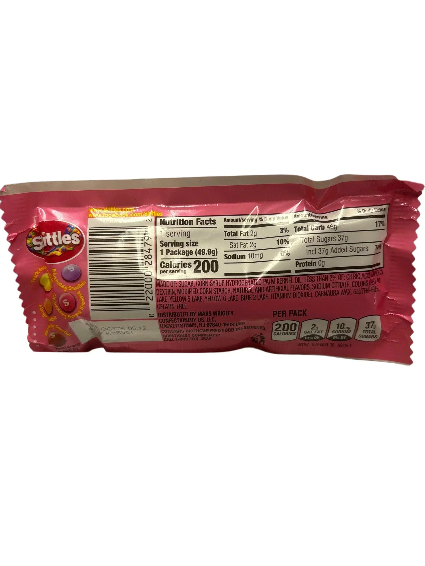 Back of Skittles candy pack showing nutritional facts and ingredients on a pink wrapper.