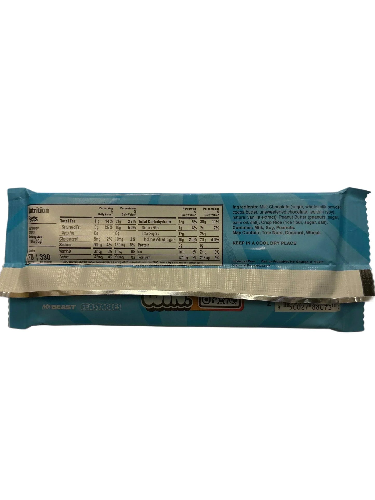 Back of a blue chocolate and peanut butter snack bar with nutrition facts and ingredients label