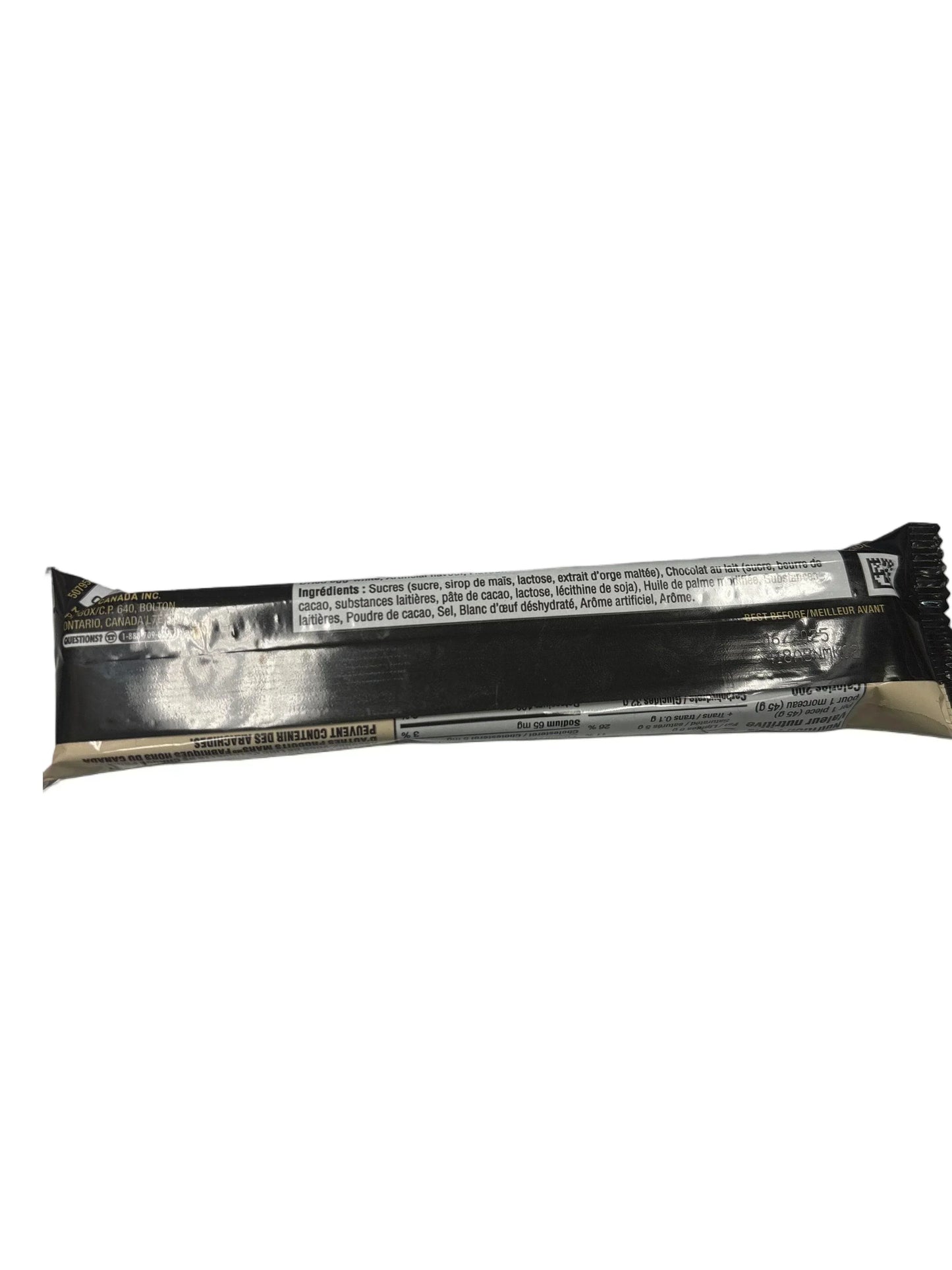 Back view of exotic snack bar in black wrapper showing nutrition and ingredient label