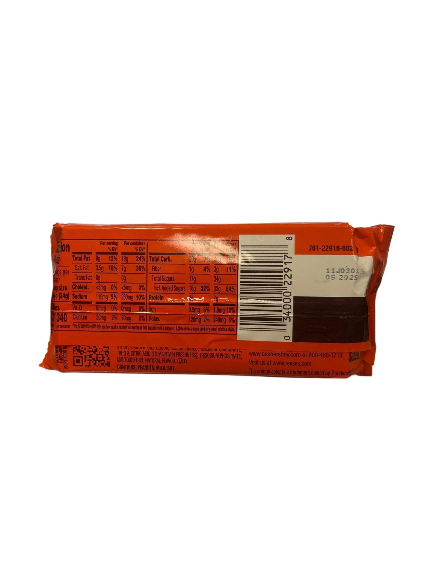 Back of orange candy bar wrapper with nutrition facts and barcode visible