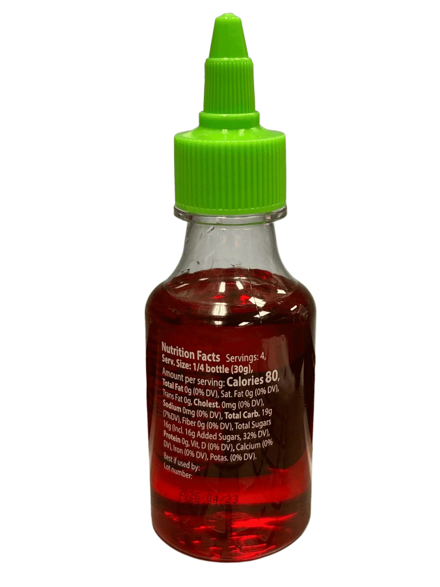 Bottle of exotic red liquid candy with green cap, nutrition facts label visible