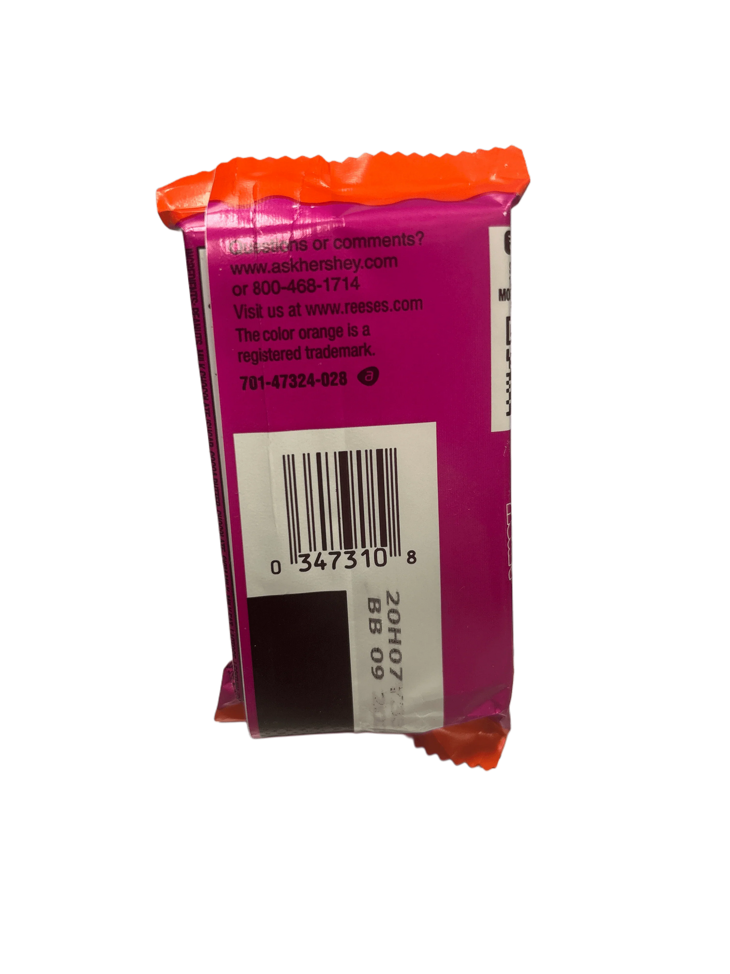 Back of a colorful candy snack package with barcode and nutrition details visible