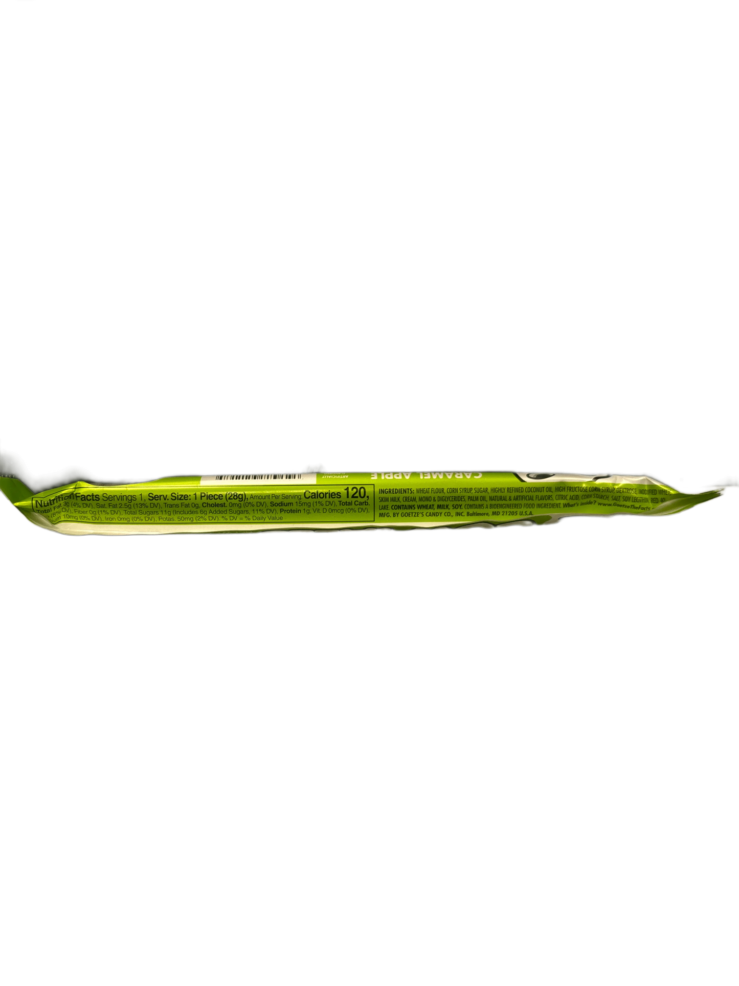 Green exotic candy bar snack in wrapper, nutrition info visible, on black background