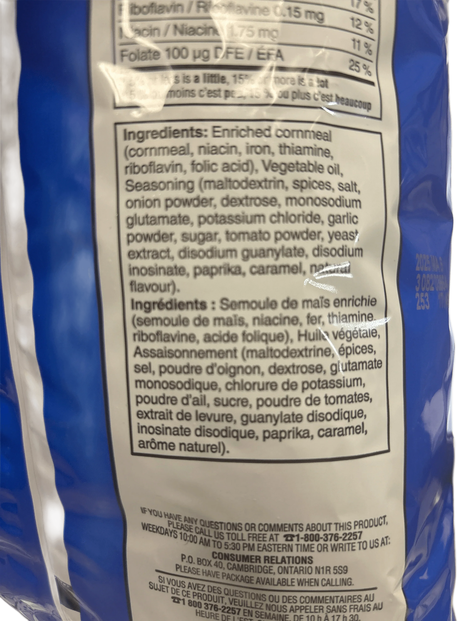 Close-up of snack bag ingredient list with enriched cornmeal and seasonings.
